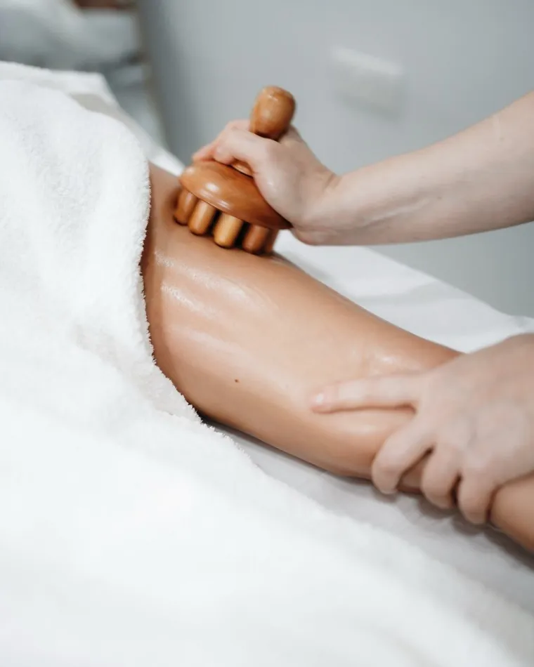 Wood therapy massage tool in use